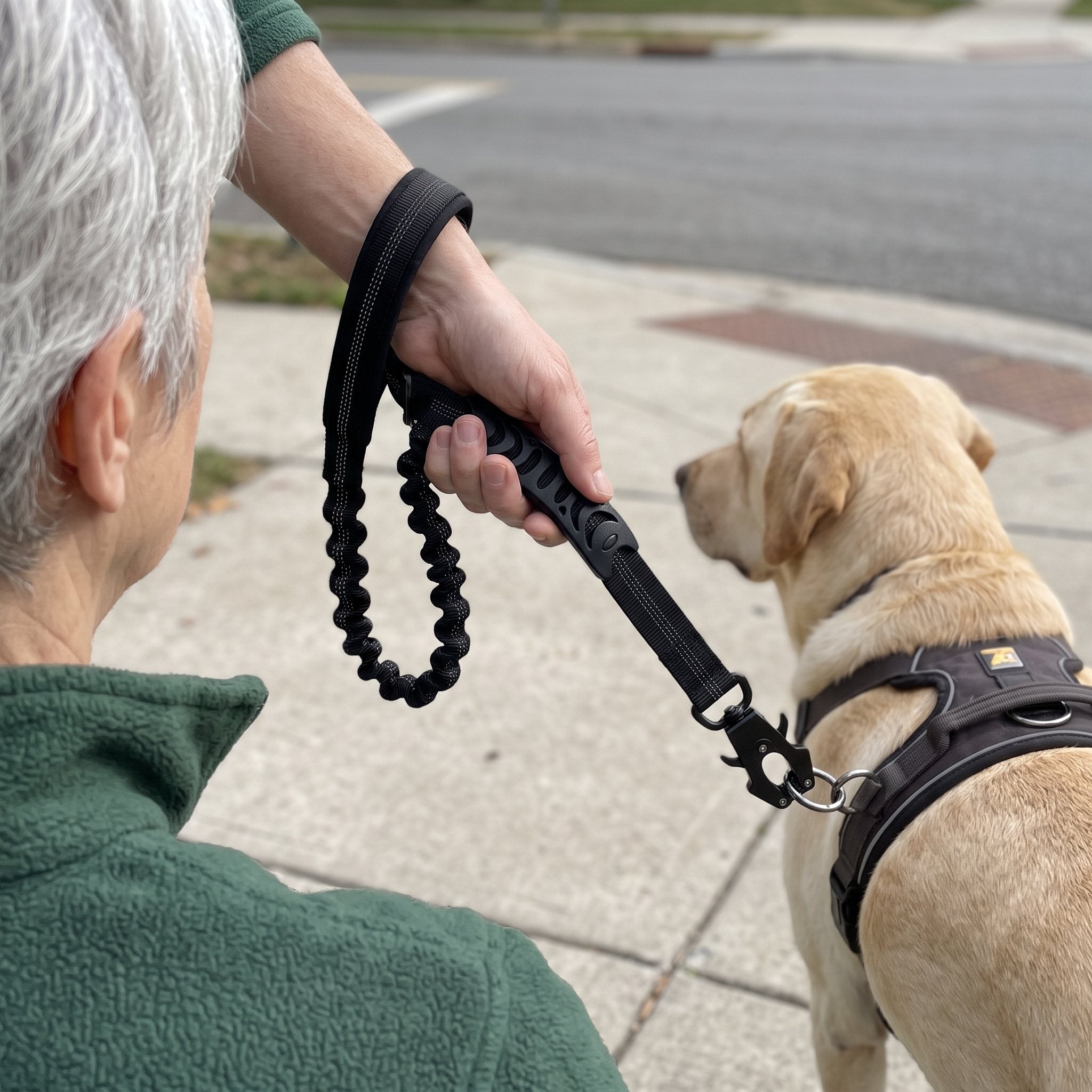 Sophie L. with a dog and Trailkind leash outdoors
